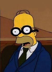 Homer Simpson asleep while performing jury duty wearing fake glasses showing wide open eyes.